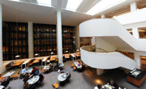 Interior of the British Library, with the smoked glass wall of the King's Library in the background.